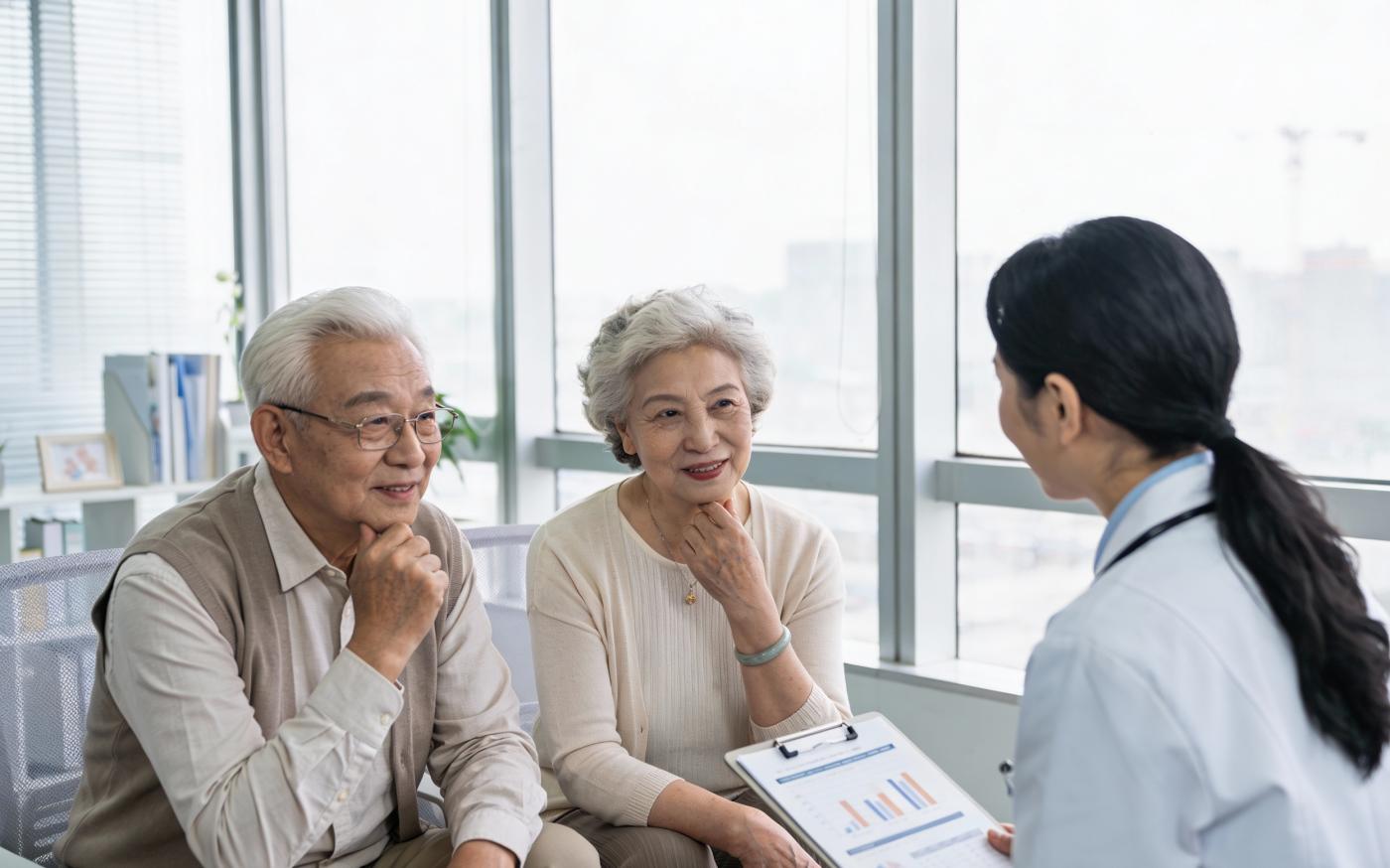 Retired couple discussing Medicare and Medicaid options with a medical professional in a clinic near Marlton, NJ. 