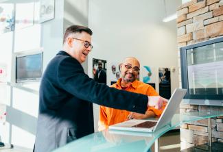 person using laptop in an office