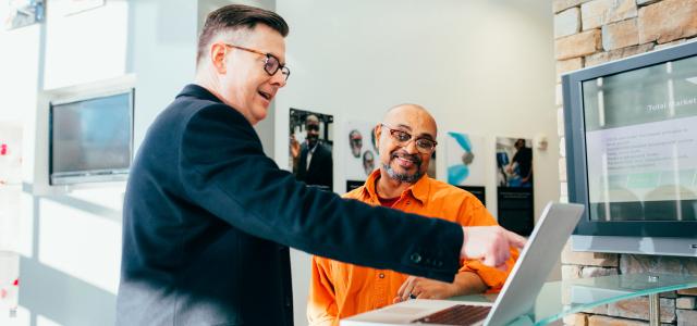 person using laptop in an office