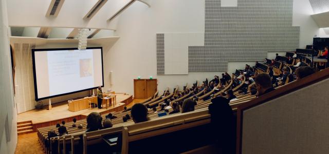 students sitting in a college lecture hall